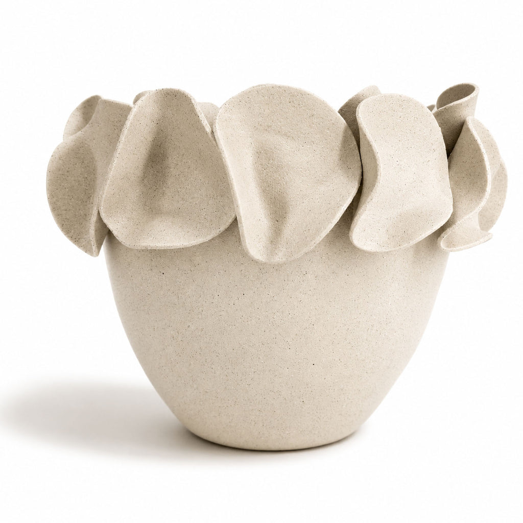 A light natural white speckled ceramic planter with a wide rim made of overlapping petal-like flaps, by Polly Barton Ceramics.