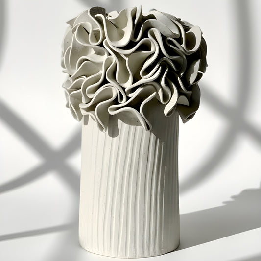 White ceramic vase with textured ruffled design